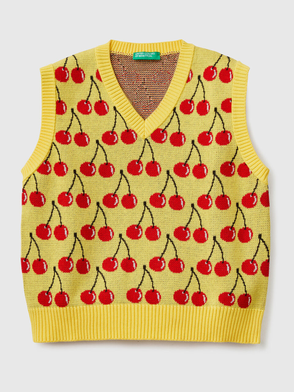 Yellow vest with cherry pattern