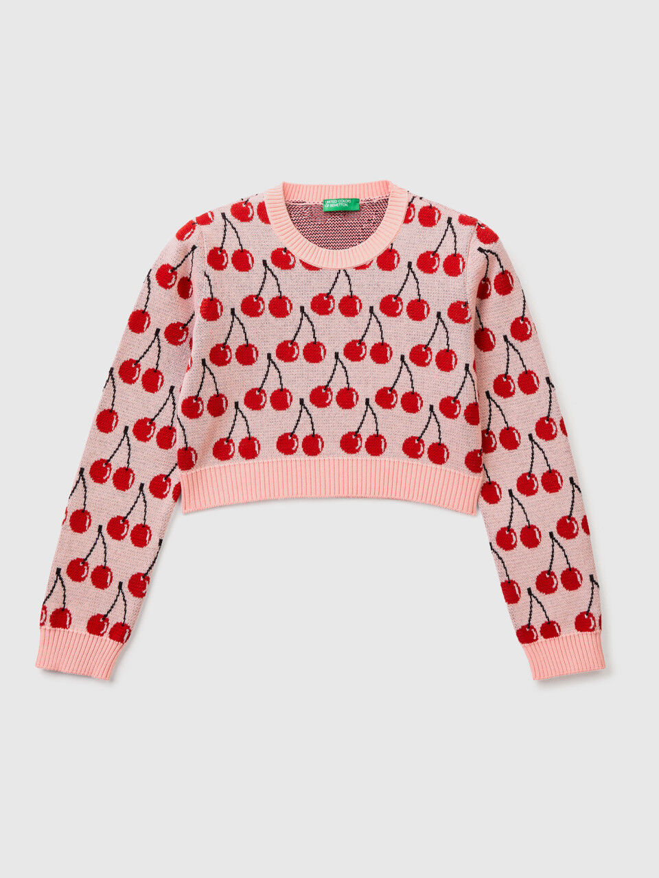 Pink cropped sweater with cherry pattern